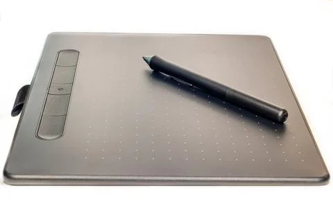 Black graphic tablet with white dots on a white background Stock Photos