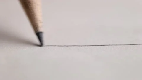 Black graphite pencil draws a straight line on a white background paper 스톡 동영상 155501484