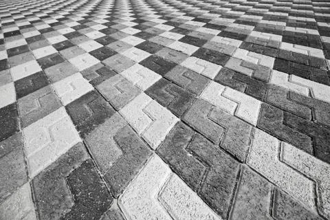 Black gray and white pattern of urban cobblestone pavement Stock Photos