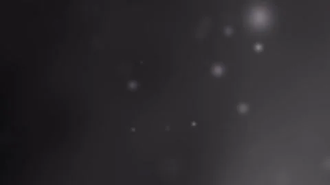 Black gray background features small blurry white lights Stock Footage 297681849