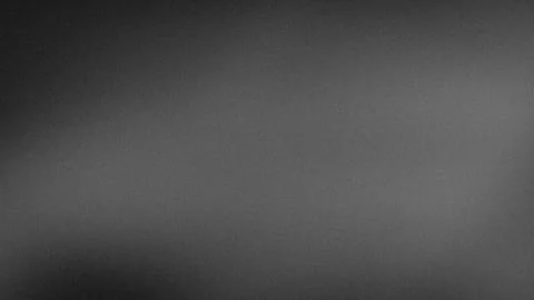 Black gray gradient abstract grainy background wallpaper with blur effect t.. Stock Photos
