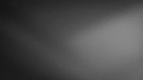 Black gray white gradient abstract grainy wallpaper background 4K blur tech.. Stock Photos