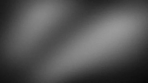 Black gray white gradient grainy abstract wallpaper background 4K blur tech.. Stock Photos