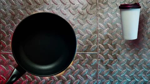 Black grill pan on fire with coffee cup Stock Footage 131858353