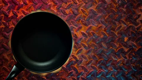 Black grill pan on fire Stock Footage 131858349