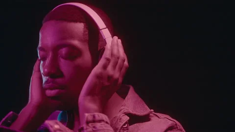 Black Guy with Headphones Vibing in Neon... | Stock Video | Pond5