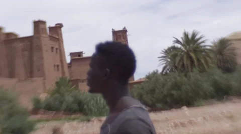 Black guy looking around at the sand houses 16 Stock Footage 67527562