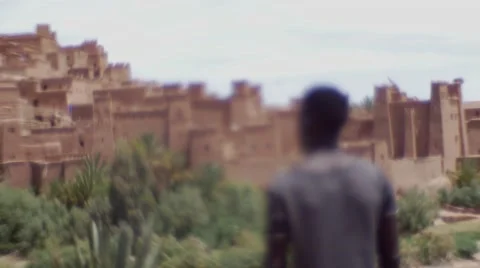 Black guy looking around at the sand houses 17 Stock Footage 67527578