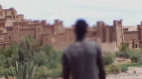 Black guy looking around at the sand houses 10 Stock Footage 67527580