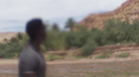 Black guy looking around at the sand houses 19 Видео 67527619