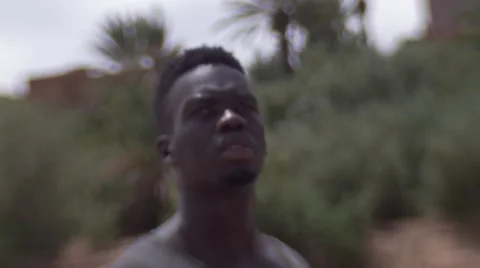 Black guy looking around at the sand houses 18 Видео 67527628