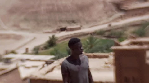 Black guy looking around at the sand houses 12 Video stock 67532045