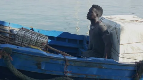 Black guy looks around while riding a boat 06 Видео 67532430