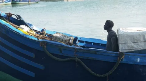 Black guy looks around while riding a boat 10 Stock Footage 68859317
