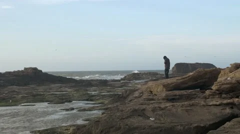 Black guy mourning beside the seashore 02 Stock Footage 67556455