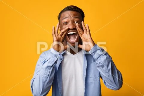 Black Guy Screaming Holding Hands Near Mouth, Studio Shot Stock Photos