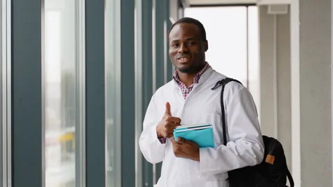 Black guy student intern happy about education, learning and future after Stock Footage 260756895