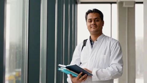 Black guy student intern happy about education, learning and future after Stock Footage 260758942