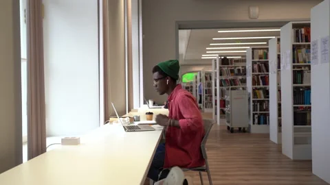 Black guy student using laptop feeling stressed while preparing for upcoming Stock Footage 221714971
