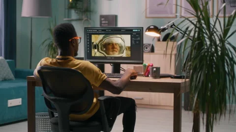 Black guy using photo editor on computer Stock Footage 162446028