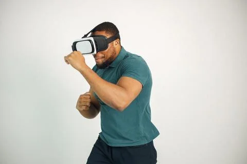 Black guy with virtual reality glasses isolated on white background Stock Photos