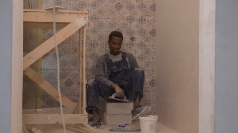 Black guy for work at a construction Video stock 104314519