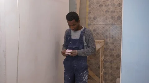 Black guy for work at a construction Stock Footage 104315166