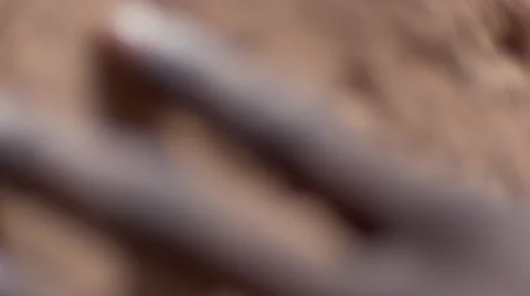 Black guy's hand touching the sand wall 03 Video stock 67528978