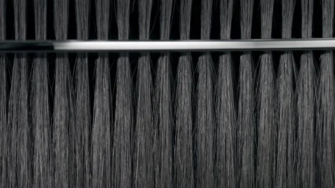 Black hair being combed with silver comb Stock Footage 171888428