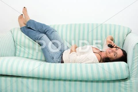 Black haired woman talking on phone Stock Photos