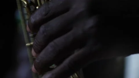 Black hand playing the keys of a saxophone Stock Footage 208940897