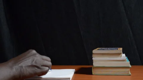 Black hand of a student dropping a pen Stock Footage 276594205