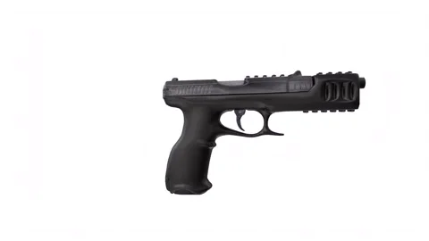 Black handgun rotating in loop on white background Stock-Footage 261791081