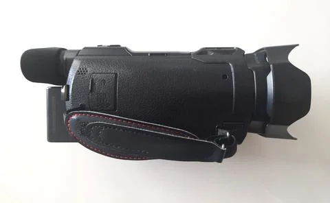 Black handheld camcorder with LCD screen, large lens hood, controls, Stock Photos