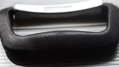 Black handle on a metal silver suitcase Stock Footage 322585884