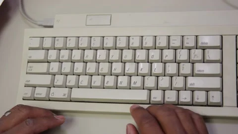 Black hands hit print command on keyboard of old classic computer Stock-Footage 131338636