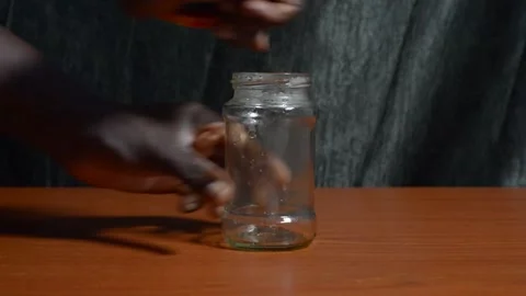 Black hands opening a jar Stock Footage 276594438