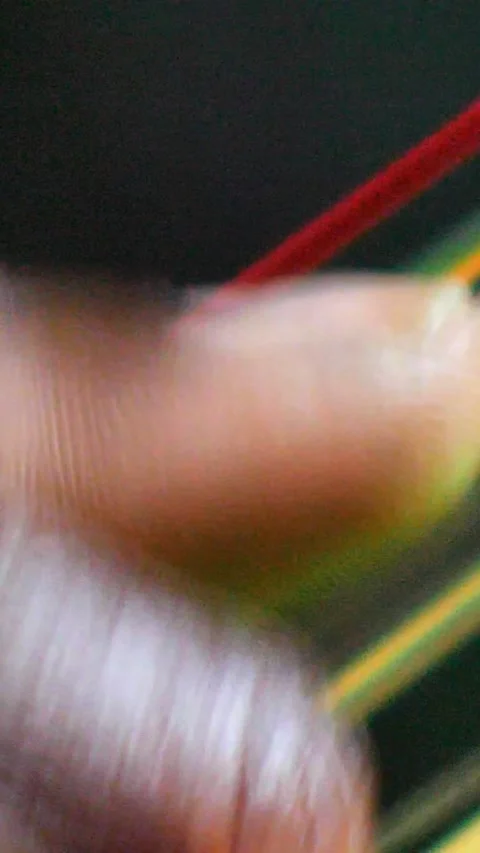 Black hands plucking the strings of kora instrument from side Video stock 230692068