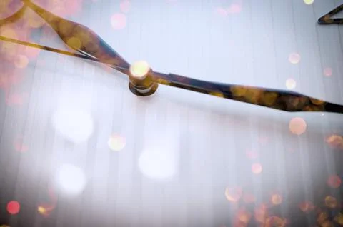 Black Hands on White Clock Face. Golden Celebration Lights Reflections. Stock Photos