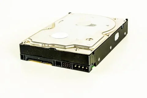 A black hard drive with a silver casing Stock Photos