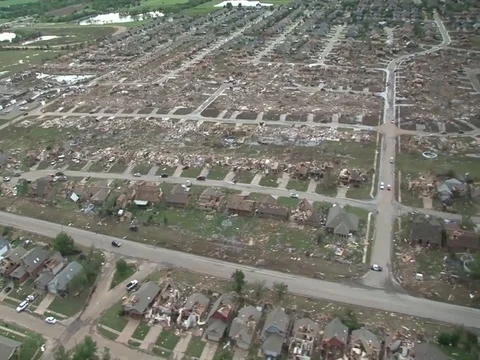 Black Hawk helicopter flies over Moore damaged area - 2013 Stock Footage 106144697