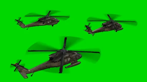 Black Hawk Helicopter fly in Formation - seperated on green screen Stock Footage 33905970