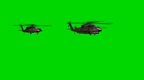 Black Hawk Helicopter fly by in Formation - seperated on green screen Stock-Footage 33906149