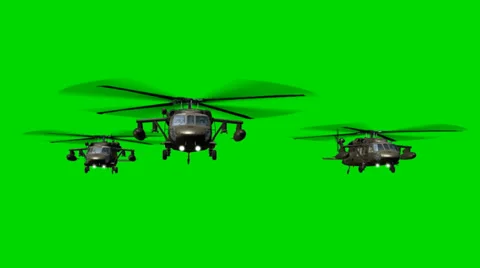 Black Hawk Helicopter fly in Formation - seperated on green screen Stock-Footage 33906171