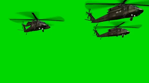 Black Hawk Helicopter fly by in Formation - seperated on green screen 库存影片 33906238