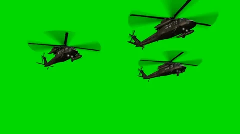 Black Hawk Helicopter fly by in Formation - seperated on green screen Stock Footage 33906332