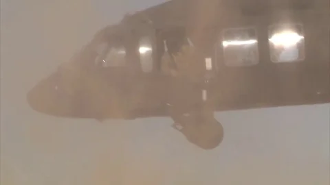 Black Hawk Helicopter leaving Kuwait in sand and dust storm Video stock 84758846