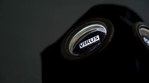 A black hazard face mask with the virus on it Stock Footage 129343707