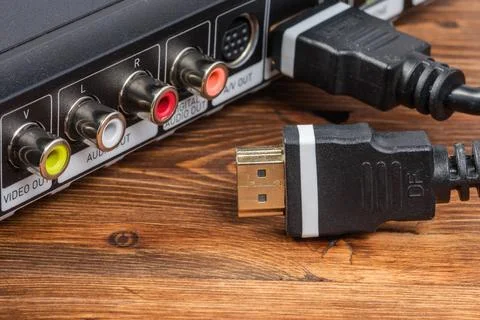 Black HDMI digital interface cable connector with a gold plated plug ready to Stock Photos