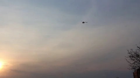 Black helicopter flies in the sky Video stock 109801896